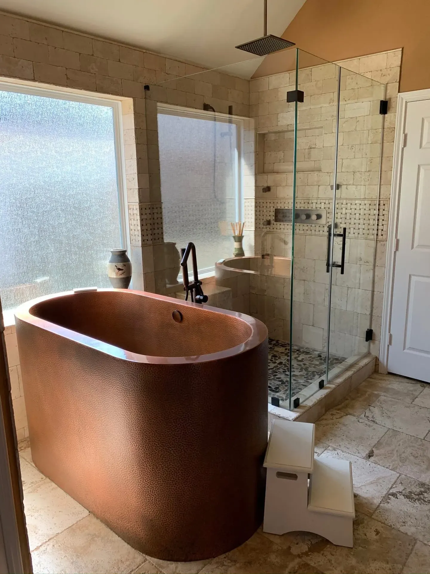 Bathroom remodel by LL General Contractor with a freestanding copper tub and a glass shower