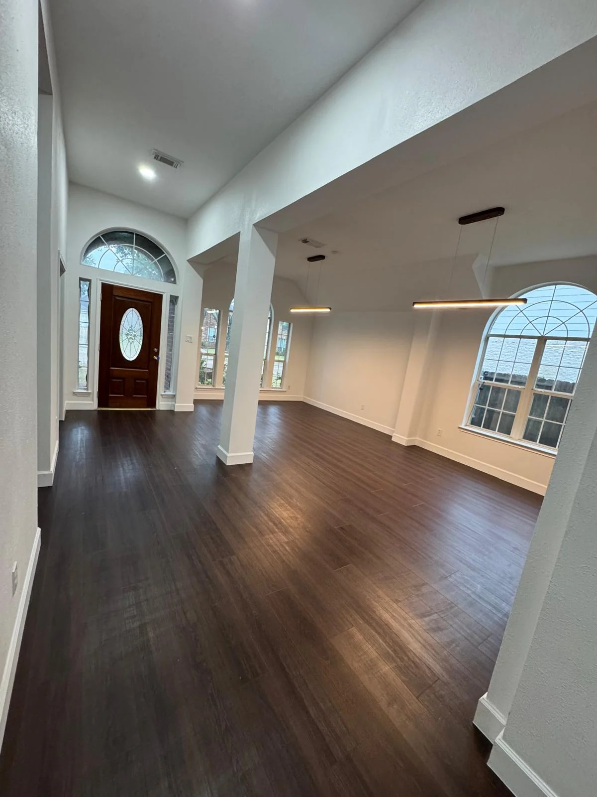 Interior remodel by LL General Contractor with an opened floor plan and hardwood floors