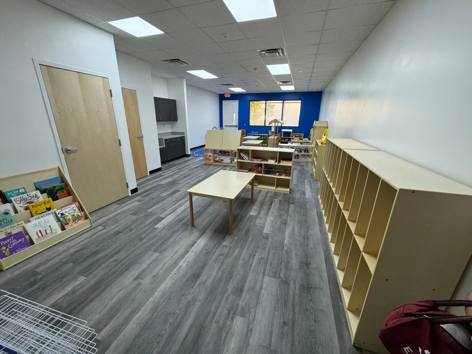 Commercial interior build-out by LL General Contractor with new flooring and shelving